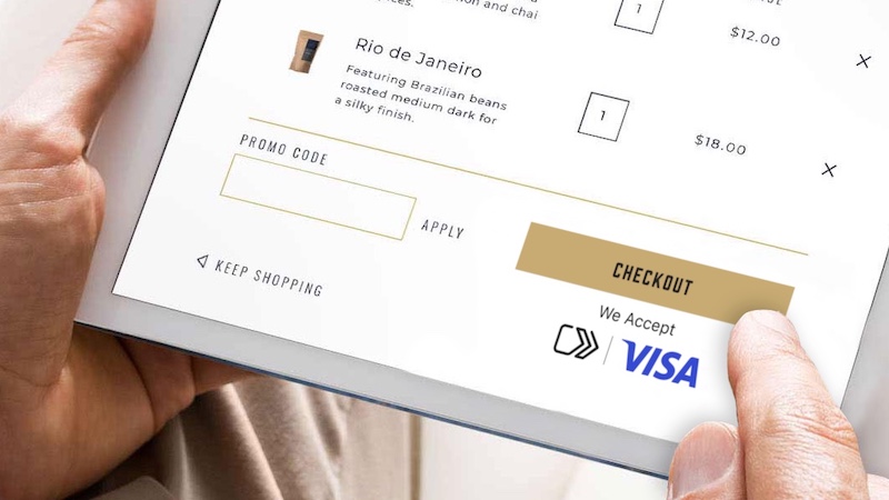 Closeup of a tablet displaying the Visa checkout experience.